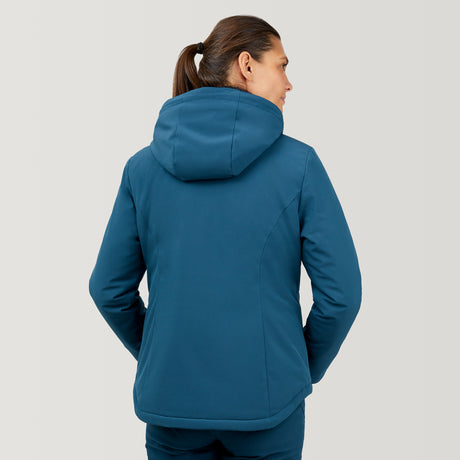 A person with brown hair in a ponytail wears the Women's Thermo Super Softshell® Ski Jacket by Clearance, standing with their back to the camera against a plain light gray background.