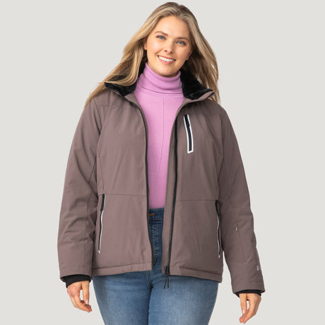 [Angela is 5'10" wearing a size 1X.] Woman wearing Free Country Women's Plus Size FreeCycle® Thermo Super Softshell® II Jacket in brown with a full front zipper opening, lower pockets, soft lining, a detachable hood with an adjustable drawcord, and water resistant and wind resistant stretch performance fabric, light grey background. Best women’s jacket for winter weather.