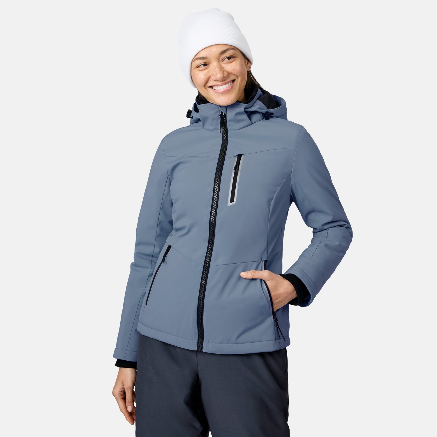 Woman wearing white knit beanie and light blue FreeCycle Thermo Softshell II jacket with front zipper.