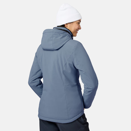 Side profile of a woman in a white knit beanie wearing the blue FreeCycle Thermo Softshell II Jacket.