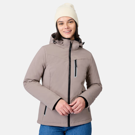 Woman modeling a beige Women's FreeCycle Thermo Softshell II jacket with a cream knit beanie