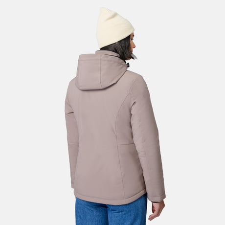 Back view of a woman wearing a beige FreeCycle Thermo Softshell II jacket and cream knit beanie.
