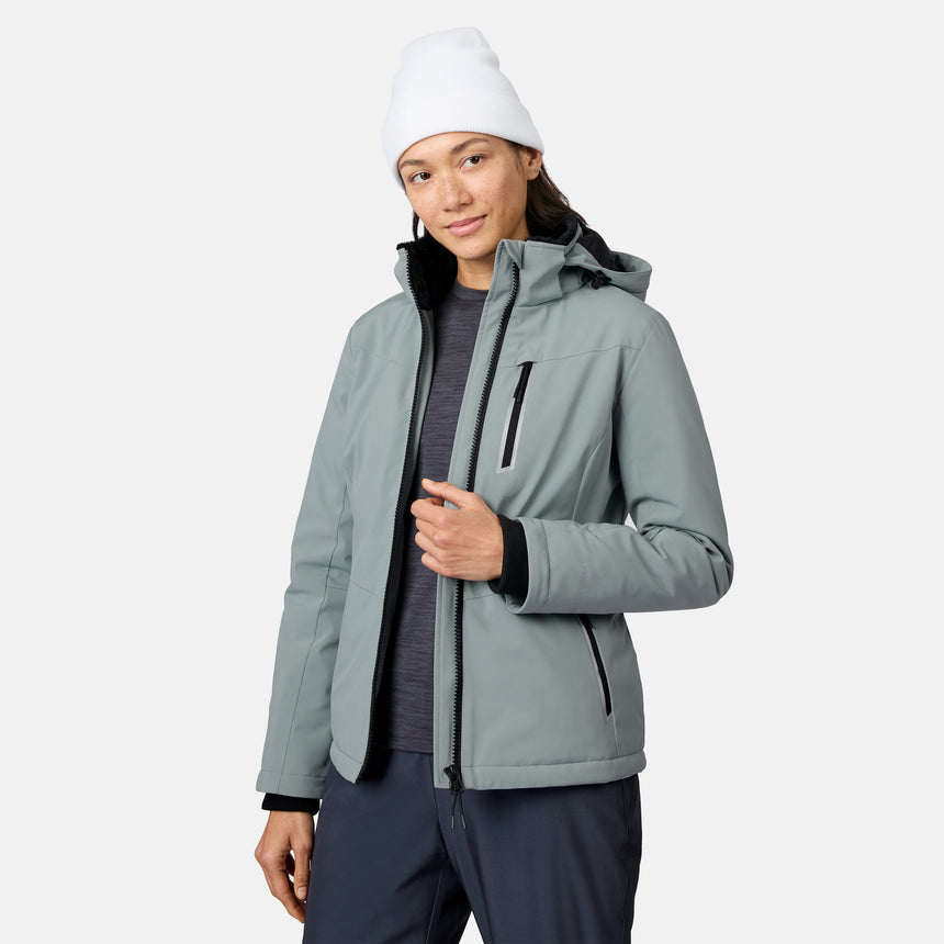 Model wearing light gray FreeCycle Thermo Softshell II jacket with black interior, front zipper open, white beanie.