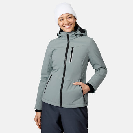 Woman wearing a light gray FreeCycle Thermo SoftShell II jacket with hood and front zipper plus a white knit beanie