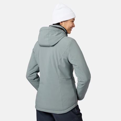 Rear view of model wearing light gray FreeCycle Thermo Softshell II jacket with hood and white beanie.