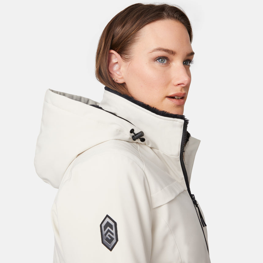 [Model is wearing size S.] Side profile of a woman wearing a white Thermo Super Softshell lined jacket with hood