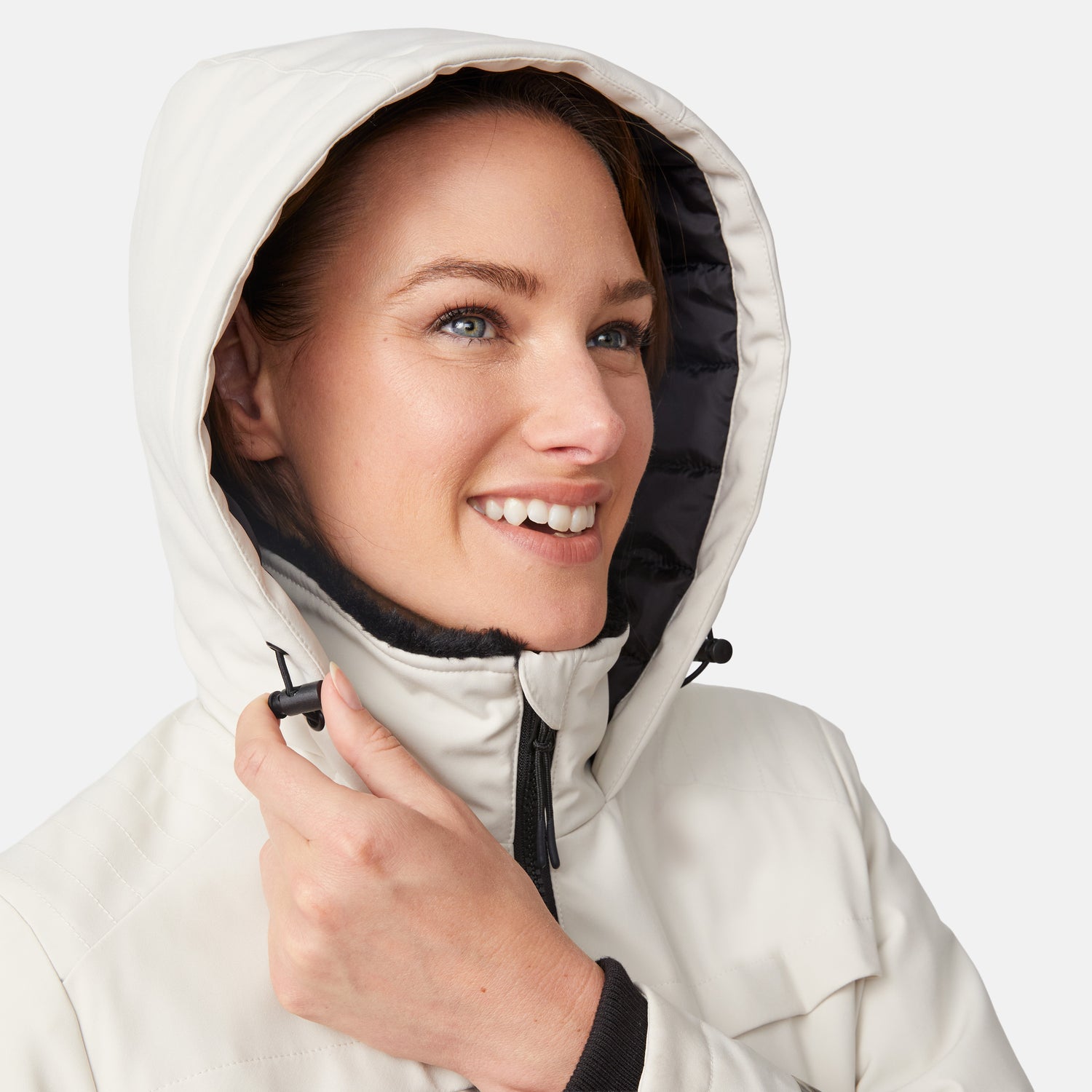 [Model is wearing size S.] Close-up of a smiling woman wearing a cream Thermo Super Softshell Lined Jacket with hood