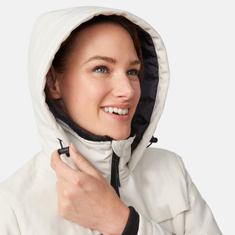 [Model is wearing size S.] Close-up of a smiling woman wearing a cream Thermo Super Softshell Lined Jacket with hood