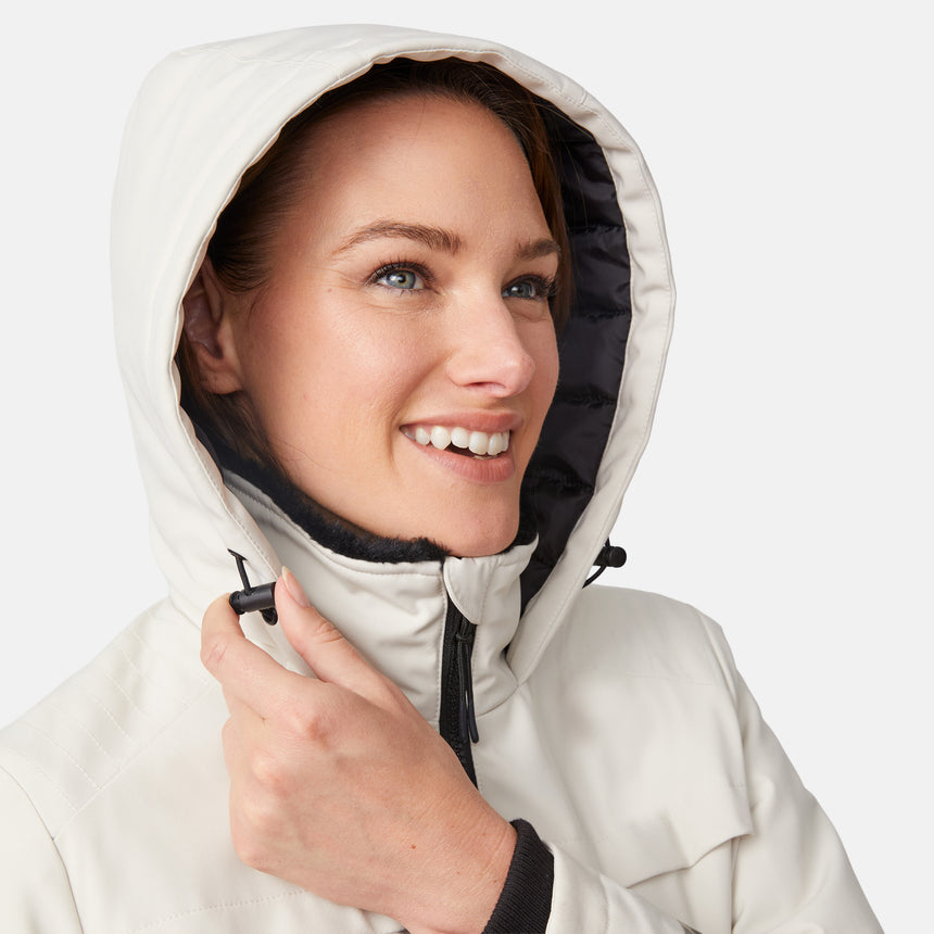 [Model is wearing size S.] Close-up of a smiling woman wearing a cream Thermo Super Softshell Lined Jacket with hood