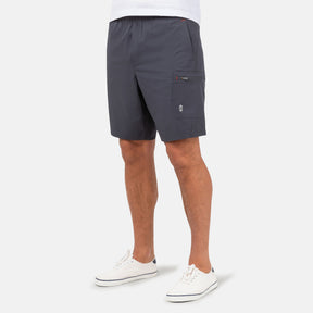 [Model is wearing a size Medium.] Man wearing Free Country Men's Tech Stretch Short II in Charcoal, size M, made from moisture wicking stretch performance fabric featuring an elastic waistband with a drawcord and a side slant pockets, styled with a white t shirt #color_charcoal
