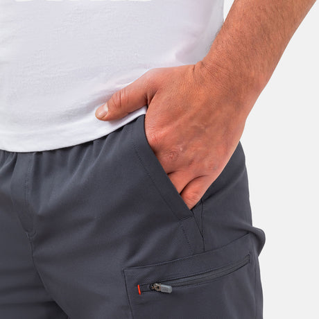 [Model is wearing a size Medium.] Man wearing Free Country Men's Tech Stretch Short II in Charcoal, size M, made from moisture wicking stretch performance fabric featuring an elastic waistband with a drawcord and a side slant pockets, styled with a white t shirt #color_charcoal