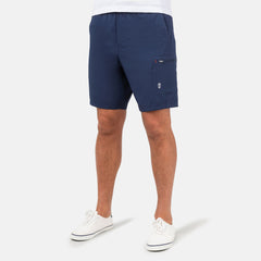 [Model is wearing a size Medium.] Man wearing Free Country Men's Tech Stretch Short II in Slate, size M, made from moisture wicking stretch performance fabric featuring an elastic waistband with a drawcord and a side slant pockets, styled with a white t shirt #color_slate