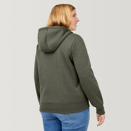 [Lola is 5’10.5” wearing a size Extra Extra Large.] Free Country Everybody Hoodies in dark green, featuring soft melange fabric, moisture-wicking properties, and black drawstrings, styled with casual T-shirts and dark pants.