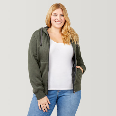[Lola is 5’10.5” wearing a size Extra Extra Large.] Free Country Everybody Hoodies in dark green, featuring soft melange fabric, moisture-wicking properties, and black drawstrings, styled with casual T-shirts and dark pants.