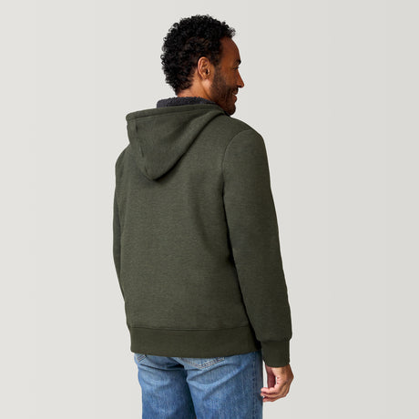[Jonathan is 6'1” wearing a size Medium.] Free Country Everybody Hoodies in dark green, featuring soft melange fabric, moisture-wicking properties, and black drawstrings, styled with casual T-shirts and dark pants.