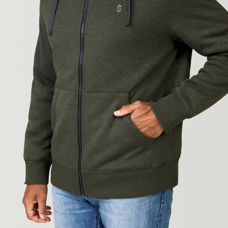 [Jonathan is 6'1” wearing a size Medium.] Free Country Everybody Hoodies in dark green, featuring soft melange fabric, moisture-wicking properties, and black drawstrings, styled with casual T-shirts and dark pants.