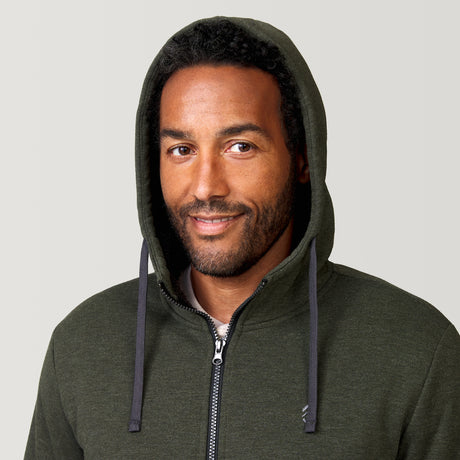 [Jonathan is 6'1” wearing a size Medium.] Free Country Everybody Hoodies in dark green, featuring soft melange fabric, moisture-wicking properties, and black drawstrings, styled with casual T-shirts and dark pants.