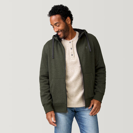 [Jonathan is 6'1” wearing a size Medium.] Free Country Everybody Hoodies in dark green, featuring soft melange fabric, moisture-wicking properties, and black drawstrings, styled with casual T-shirts and dark pants.
