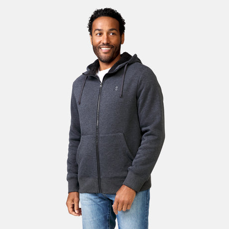 [Jonathan is 6'1” wearing a size Medium.] Free Country Everybody Hoodies in dark grey, featuring soft melange fabric, moisture-wicking properties, and black drawstrings, styled with casual T-shirts and dark pants.