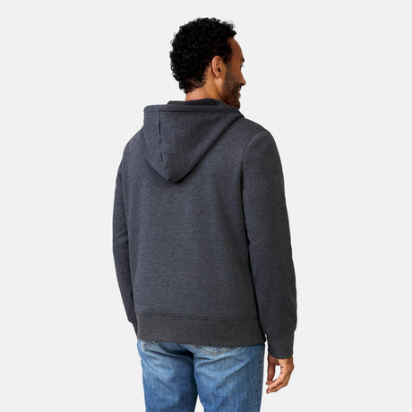 [Jonathan is 6'1” wearing a size Medium.] Free Country Everybody Hoodies in dark grey, featuring soft melange fabric, moisture-wicking properties, and black drawstrings, styled with casual T-shirts and dark pants.