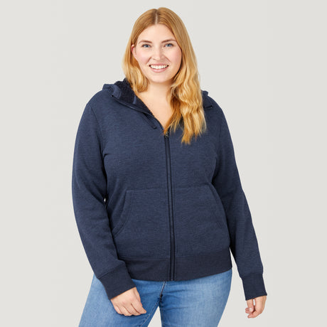 [Lola is 5’10.5” wearing a size Extra Extra Large.] Free Country Everybody Hoodies in navy, featuring soft melange fabric, moisture-wicking properties, and black drawstrings, styled with casual T-shirts and dark pants.