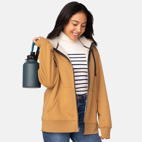[Model is wearing a size Small.] The Free Country Everybody Hoodies in yellow, featuring soft melange fabric, moisture-wicking properties, and black drawstrings, styled with casual T-shirts and dark pants.