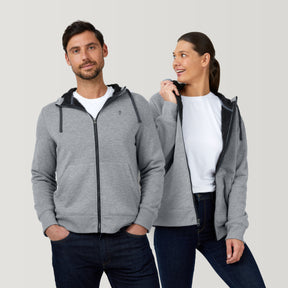 [Models are wearing a size Medium.] Man and woman wearing matching Free Country Everybody Hoodies in gray, featuring soft melange fabric, moisture-wicking properties, and black drawstrings, styled with casual T-shirts and dark pants.