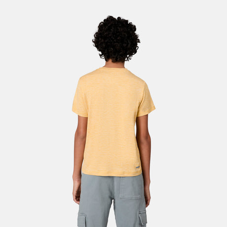 A person with curly hair is facing away from the camera, wearing a yellow Free Country Boys' Microtech® Crew Neck Shirt and light gray cargo shorts against a plain white background.