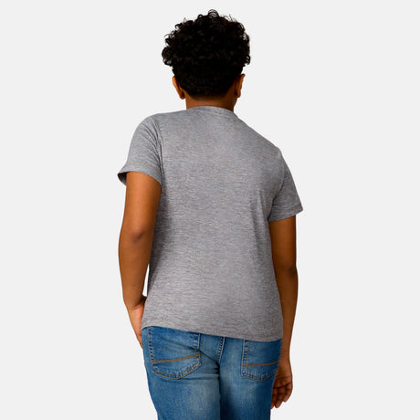 [Model is wearing a size Medium.] Boy wearing the Free Country Boys' Microtech® Graphic Crew Neck Shirt in Rock, size M, featuring lightweight odor free fabric and upf protection, paired with blue jeans #color_ rock