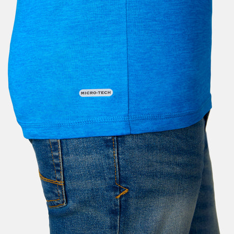 [Model is wearing a size Medium.] Boy wearing the Free Country Boys' Microtech® Graphic Crew Neck Shirt in Royal, size M, featuring lightweight odor free fabric and upf protection, paired with blue jeans #color_ royal