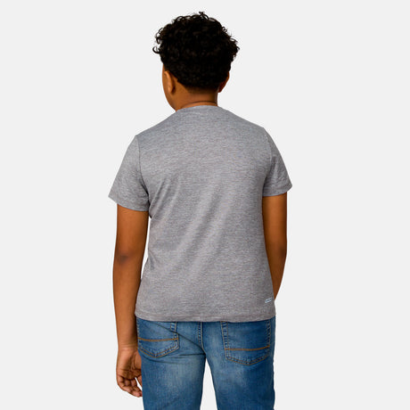 [Model is wearing a size Medium.] Boy wearing the Free Country Boys' Microtech® Crew Neck Shirt in Rock, size M, featuring lightweight odor free fabric and upf protection, paired with blue jeans #color_ rock