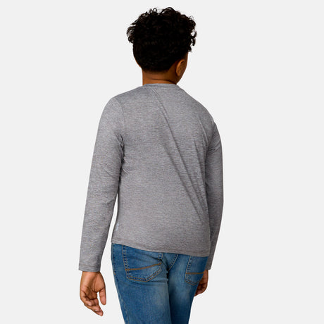 [Model is wearing a size Medium.] Boy wearing the Free Country Boys' Microtech® Long Sleeve Shirt in Rock, size M, featuring lightweight odor free fabric and upf protection, paired with blue jeans #color_ rock