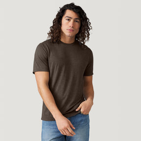 A man wearing a hickory-colored Men’s Super Soft Microtech® Short Sleeve Crew Tee and blue jeans.