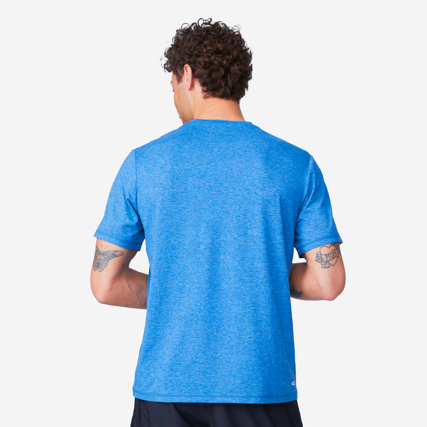 Back view of a person wearing a moisture-wicking blue Men’s Super Soft Microtech® Short Sleeve Crew Tee with four-way stretch.