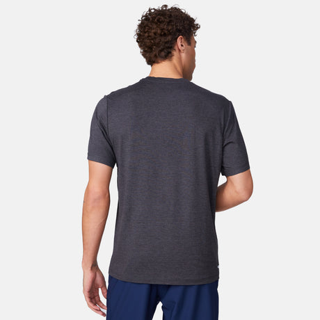 [Miguel is 6'2" wearing a size Medium.] Man wearing Free Country Men's Super Soft Short Sleeve Crew Tee - 2 Pack in Black, size M, made from anti-odor, breathable lightweight performance fabric featuring a classic active fit and a peached finish #color_black