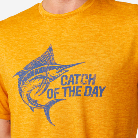 [Miguel is 6'2" wearing a size Medium.] Man wearing Free Country Men's Super Soft Short Sleeve Crew Tee - 2 Pack in Iron, size M, made from anti-odor, breathable lightweight performance fabric featuring a classic active fit, a catch of the day front design, and a peached finish #color_citrus