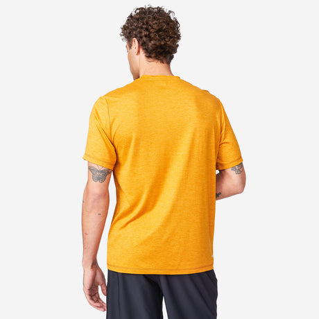 [Miguel is 6'2" wearing a size Medium.] Man wearing Free Country Men's Super Soft Short Sleeve Crew Tee - 2 Pack in Iron, size M, made from anti-odor, breathable lightweight performance fabric featuring a classic active fit, a catch of the day front design, and a peached finish #color_citrus