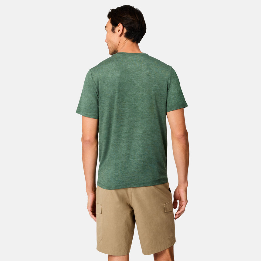 [Scott is 6’3" wearing size M] Back view of man wearing a green t-shirt and beige shorts on a white background