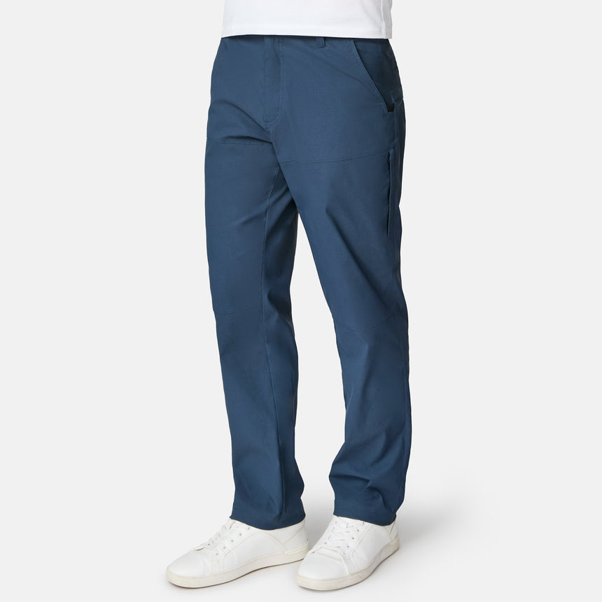 Blue pants worn by a person on a white background