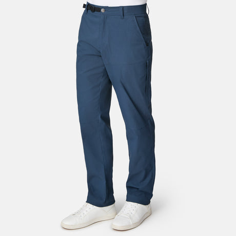 Blue pants worn by a person on a white background