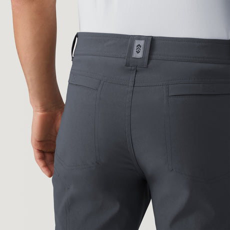 [Model is wearing a size Medium.] Men's Nylon Stretch Convertible Pant - Deep Charcoal #color_deep-charcoal