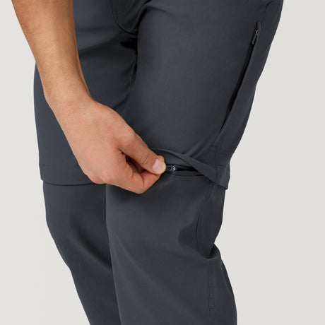 [Model is wearing a size Medium.] Men's Nylon Stretch Convertible Pant - Deep Charcoal #color_deep-charcoal
