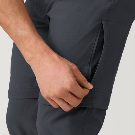 [Model is wearing a size Medium.] Men's Nylon Stretch Convertible Pant - Deep Charcoal #color_deep-charcoal