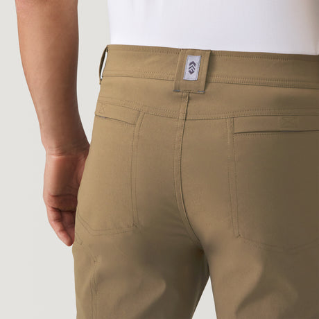 [Model is wearing a size Medium.] Men's Nylon Stretch Convertible Pant - Khaki #color_khaki