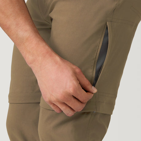 [Model is wearing a size Medium.] Men's Nylon Stretch Convertible Pant - Khaki #color_khaki