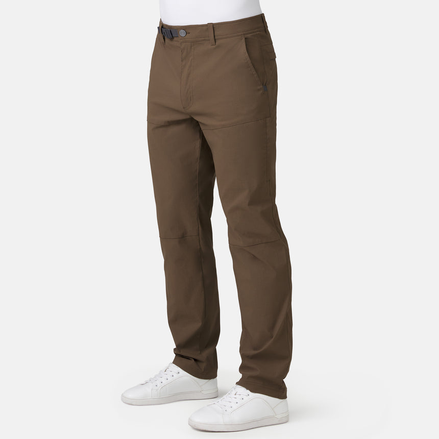 Brown pants worn by a person on a white background