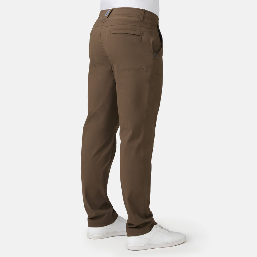 Brown pants worn by a person on a white background