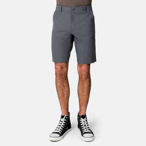 Coal Men’s Nylon Stretch Casual Short versatile shorts in dark grey with a side zipper pocket, worn with black high-top sneakers.