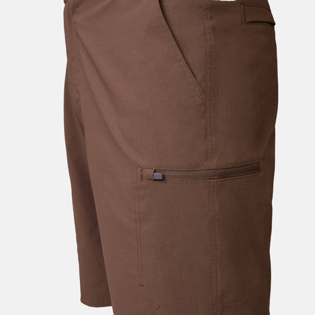 [Model is wearing a size Medium.] Man wearing Free Country Men's Nylon Stretch Casual Short in Saddle, size M, made from lightweight stretch performance fabric featuring a water repellent finish, slanted side pockets, and side leg zippered coin pocket #color_saddle