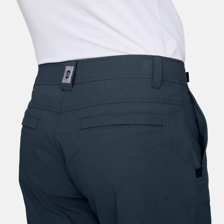 Free Country Men's Nylon Stretch Trek Short in Steel, size M, made from lightweight stretch performance fabric featuring a water repellent finish, an adjustable waist belt, two back welt pockets, and two side sipper pockets #color_steel